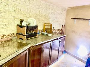 a kitchen with a sink and a counter top at Pink city cottage in Wadi Musa