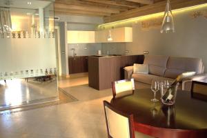 a living room with a table and a couch at Verona Luxury Flats , Piazza Erbe with balcony on main square in Verona
