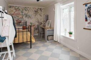 a bedroom with a bed and a desk and a window at Big house with jacuzzi by the forrest in Hudiksvall +62 photos