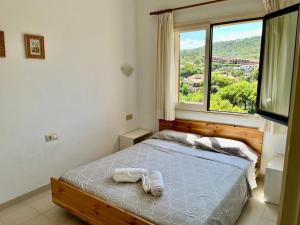Posteľ alebo postele v izbe v ubytovaní Casa ASIA. Relax a 5 minutos de las calas TOP.