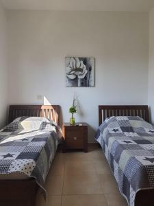 two beds sitting next to each other in a bedroom at Yama's Villa - Polyxenia luxury, protaras, cyprus in Protaras
