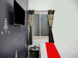 Et tv og/eller underholdning på OYO Flagship 81208 Laxmi Guest House Jadavpur