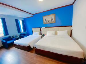 Postel nebo postele na pokoji v ubytování A25 Hotel - 61 Lương Ngọc Quyến