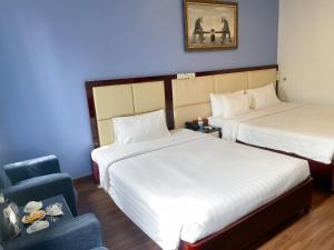 Postel nebo postele na pokoji v ubytování A25 Hotel - 61 Lương Ngọc Quyến