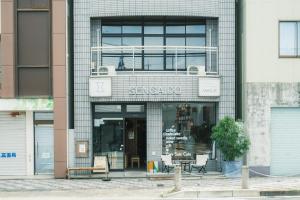 a store front of a building with a sign on it at Okazaki Micro Hotel ANGLE in Okazaki
