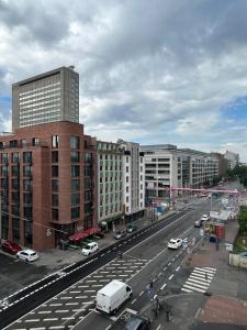 a view of a city with cars and buildings at HOSTEL Bahnhof in Frankfurt