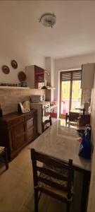 a kitchen with a large table in a room at Home Rome Center in Rome