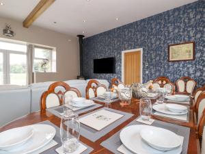 a dining room with a table and chairs at The Gatehouse in Kendal