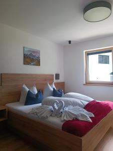 a bedroom with two beds and a window at Alpenoase in Schwendau