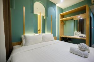Postel nebo postele na pokoji v ubytování Wellesley Hotel