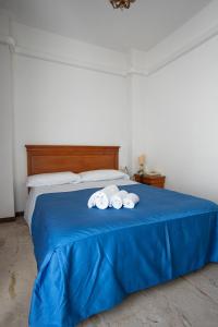 Postel nebo postele na pokoji v ubytování Hotel Napoleon