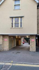 an empty parking lot in a building with a garage at 2 Bedroom Flat Ground Floor Town Centre Colchester in Colchester