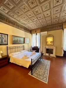 a bedroom with a bed and a coffered ceiling at Dimora '800 in Ferrara