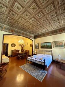 a bedroom with a bed and a coffered ceiling at Dimora '800 in Ferrara