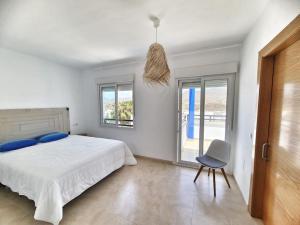 En eller flere senge i et værelse på Villa Galerna de Mar