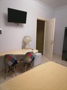 TV a/nebo společenská místnost v ubytování B&B Dolce Casa