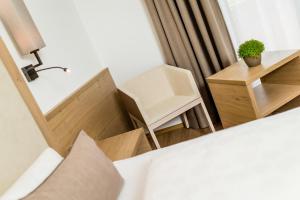 Voodi või voodid majutusasutuse Garni Hotel Am Meilenstein toas