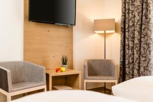 Voodi või voodid majutusasutuse Garni Hotel Am Meilenstein toas