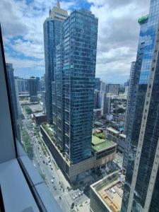 an aerial view of a city with tall buildings at Stylish 1BR Uptown Parksuites BGC, 200mbps/SmartTv in Manila