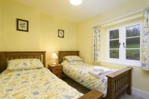 מיטה או מיטות בחדר ב-2 Lower Spire