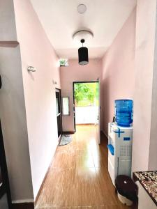 a hallway of a house with a room with a floor at The BackpackStack in Ujjain