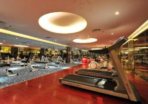 a gym with treadmills in a building at Deluxe Twin Room AYS in Kota Kinabalu