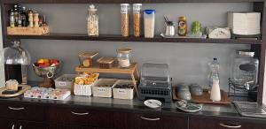 a shelf with a counter top with items on it at Albergo Elvezia in Rivera