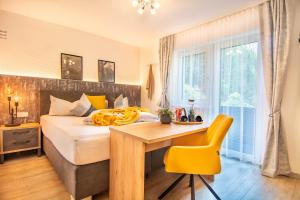 Postel nebo postele na pokoji v ubytování Gästehaus Julia