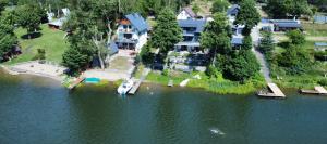 an aerial view of a house on a lake at Weranda in Wdzydze Kiszewskie