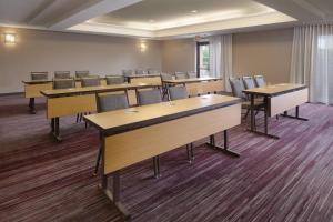 a classroom with tables and chairs in a room at Courtyard by Marriott Houston Northwest in Houston