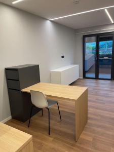 an office with a desk and a chair in a room at Wohnung in Vilshofen in Vilshofen an der Donau