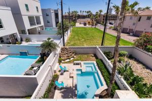 an aerial view of a swimming pool in a house at 3-level townhome w/ private pool & close to beach! in South Padre Island