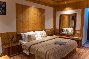 A bed or beds in a room at THE CONIFER