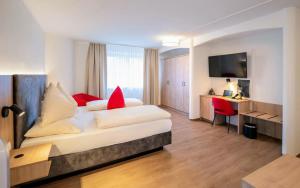 Voodi või voodid majutusasutuse Hotel Rosenvilla toas