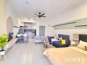 a large living room with a bed and a kitchen at Netizen near MRT Balcony View in Cheras