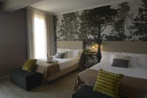 Postel nebo postele na pokoji v ubytování Hotel Villa Cappugi + 37 fotografií
