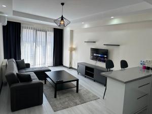 TV a/nebo společenská místnost v ubytování Rose Plus Residence