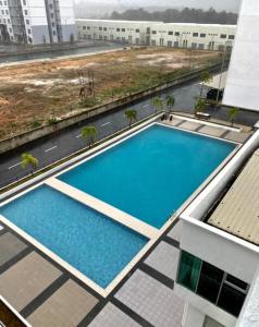 an overhead view of a swimming pool on top of a building at Casa Ipoh Homestay by Comfort Home in Chemor