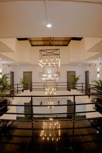 a large hall with a chandelier in the middle at Hotel Royal Accord in Surat