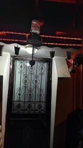 a black door with a light on top of it at AYTEN'NİN KIR EVİ in Trabzon