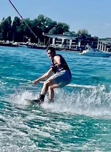 a man on water skis in the water at Ferienwohnung Louise 50 m zum See in Kressbronn am Bodensee