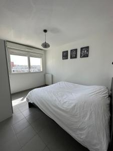 Ένα ή περισσότερα κρεβάτια σε δωμάτιο στο Appartement 3 pièces + terrasse