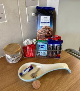 a toothbrush and a pair of scissors sitting on a table at The Annexe in Waltham