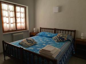 En eller flere senge i et værelse på Casa Trecci