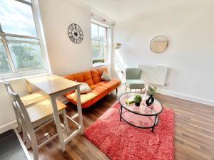 a living room with a couch and a table at Chic 2-Bed Apartment in Southampton with Parking in Southampton