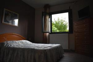 Postel nebo postele na pokoji v ubytování Ktima Nostos