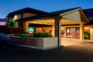 a building with a sign in front of it at Courtyard Houston/Brookhollow in Houston