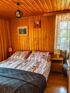 Una cama o camas en una habitación de Wynajem Pokoi Gościnnych