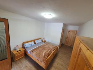 Postel nebo postele na pokoji v ubytování Farma Horní Paseky u Aše
