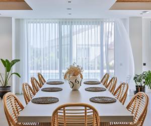 a dining room with a white table and chairs at Carruba Boutique Hotel in Kas +91 photos
